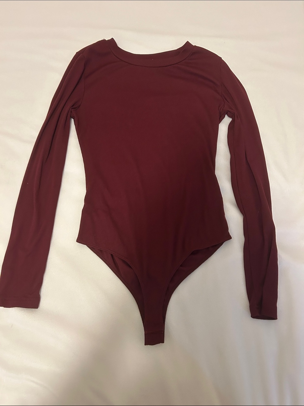 Long Sleeve body suit in the color red wine